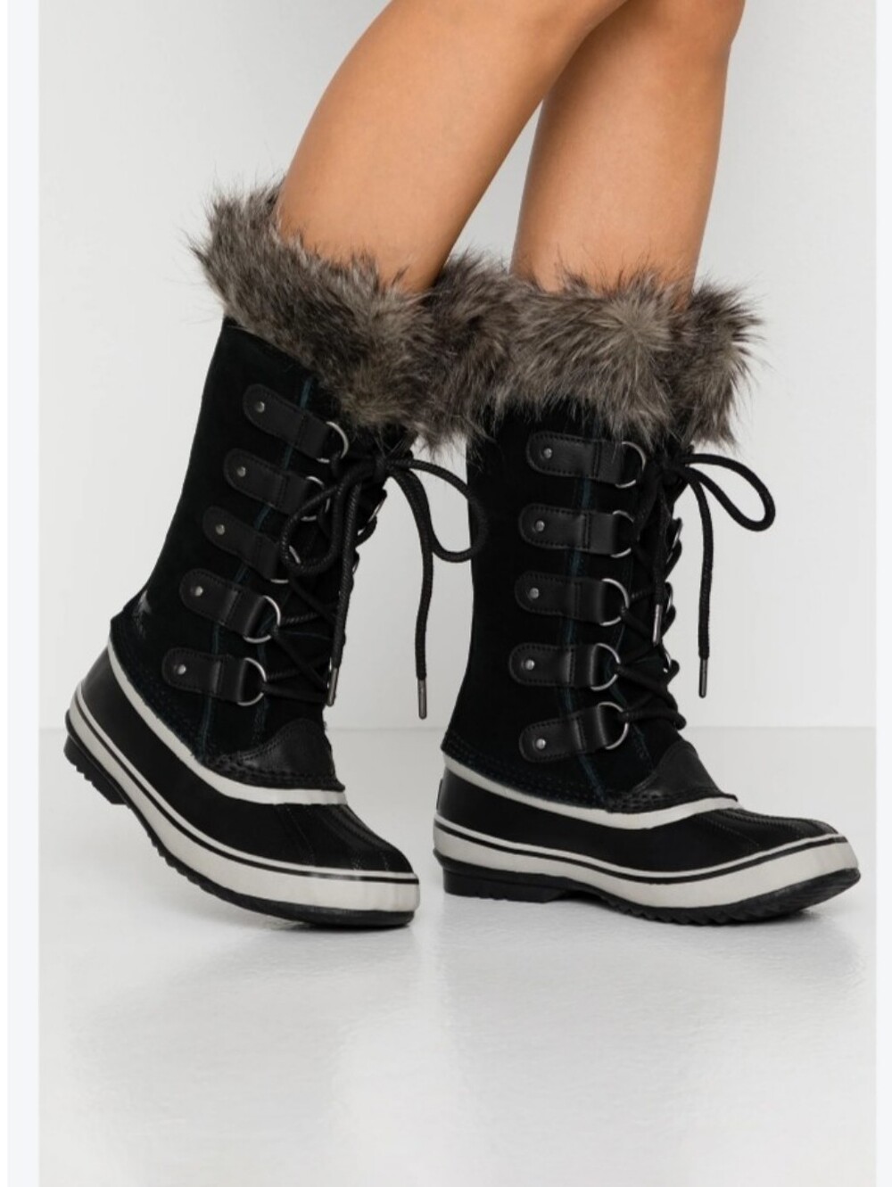 Sorel black waterproof lace-up snow boots with a faux fur trim